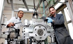 Thomas Doki-Thonon (left) and Nicolas Devaux with the Tribogyr test machine.