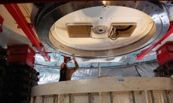 Principal Investigator John Carlstrom measures the run-out of the newly installed bearing before it is mated with its seat below.